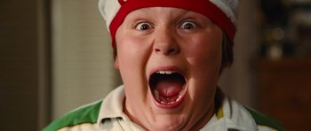 Movie still from “Diary of a Wimpy Kid: Rodrick Rules” (2011), directed by David Bowers – A young boy with a red hat and mouth open; Close Up shot, Overhead angle