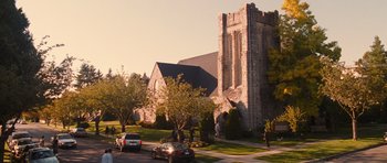 Movie still from “Diary of a Wimpy Kid: Rodrick Rules” (2011), directed by David Bowers – Cars parked on the side of the road in front of a church; Extreme Wide shot, Low angle