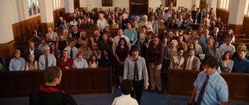 Movie still from “Diary of a Wimpy Kid: Rodrick Rules” (2011), directed by David Bowers – A group of people standing in front of each other in a church; Wide shot, High angle