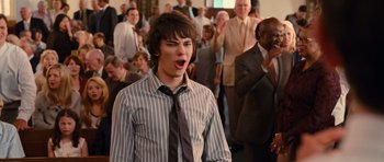 Movie still from “Diary of a Wimpy Kid: Rodrick Rules” (2011), directed by David Bowers – A young man in a striped shirt and a tie; Close Up shot, Low angle