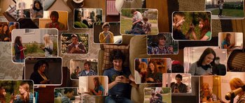 Movie still from “Diary of a Wimpy Kid: Rodrick Rules” (2011), directed by David Bowers – A man sitting on a couch looking at a phone; Wide shot, Overhead angle