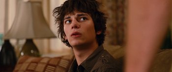 Movie still from “Diary of a Wimpy Kid: Rodrick Rules” (2011), directed by David Bowers – A young man is looking into the distance; Close Up shot, Over the shoulder angle