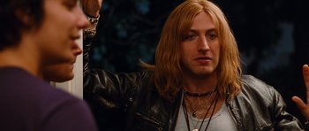 Movie still from “Diary of a Wimpy Kid: Rodrick Rules” (2011), directed by David Bowers – A person with long blonde hair; Close Up shot, Over the shoulder angle