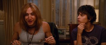 Movie still from “Diary of a Wimpy Kid: Rodrick Rules” (2011), directed by David Bowers – A woman sitting in a chair in front of a man; Close Up shot, Over the shoulder angle