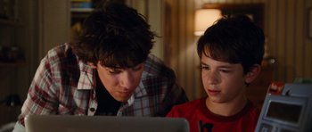 Movie still from “Diary of a Wimpy Kid: Rodrick Rules” (2011), directed by David Bowers – Two young boys looking at a computer screen; Close Up shot, Over the shoulder angle