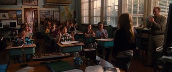 Movie still from “Diary of a Wimpy Kid: Rodrick Rules” (2011), directed by David Bowers – A group of people sitting in a classroom; Wide shot, Over the shoulder angle