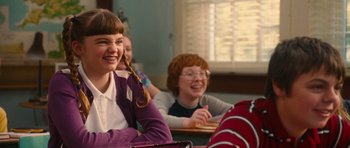 Movie still from “Diary of a Wimpy Kid: Rodrick Rules” (2011), directed by David Bowers – A group of people sitting at a table; Medium shot, Over the shoulder angle