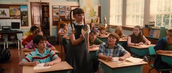 Movie still from “Diary of a Wimpy Kid: Rodrick Rules” (2011), directed by David Bowers – A group of children sitting at desks in a class room; Medium shot, Over the shoulder angle