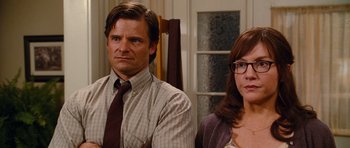 Movie still from “Diary of a Wimpy Kid: Rodrick Rules” (2011), directed by David Bowers – A man and a woman sitting next to each other in a room; Close Up shot, Over the shoulder angle