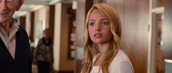 Movie still from “Diary of a Wimpy Kid: Rodrick Rules” (2011), directed by David Bowers – A beautiful young lady with long blonde hair and blue eyes; Close Up shot, Over the shoulder angle