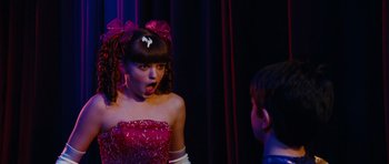 Movie still from “Diary of a Wimpy Kid: Rodrick Rules” (2011), directed by David Bowers – A young girl in a red dress is talking to a young boy; Close Up shot, Over the shoulder angle