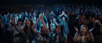 Movie still from “Diary of a Wimpy Kid: Rodrick Rules” (2011), directed by David Bowers – A group of people are clapping in a room; Wide shot, High angle