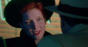 Movie still from “Dick Tracy” (1990), directed by Warren Beatty – A person wearing a hat; Close Up shot, Over the shoulder angle