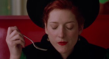 Movie still from “Dick Tracy” (1990), directed by Warren Beatty – A person wearing a hat and holding a spoon; Close Up shot, Overhead angle