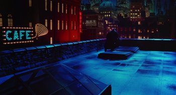 Movie still from “Dick Tracy” (1990), directed by Warren Beatty – A view of a city at night from a rooftop; Extreme Wide shot, High angle