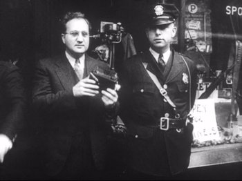 Two police officers standing next to each other