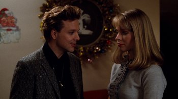 Movie still from “Diner” (1982), directed by Barry Levinson – A man and a woman standing next to each other; Close Up shot, Over the shoulder angle