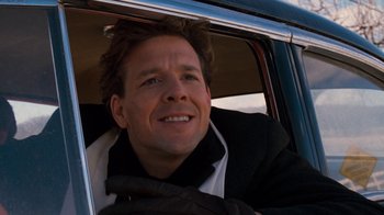 Movie still from “Diner” (1982), directed by Barry Levinson – A person sitting in a car; Close Up shot, Low angle