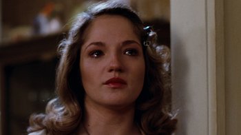 Movie still from “Diner” (1982), directed by Barry Levinson – A person wearing a dress; Close Up shot, Over the shoulder angle