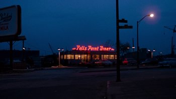 Movie still from “Diner” (1982), directed by Barry Levinson – A night time picture of the fells point diner; Extreme Wide shot, Low angle