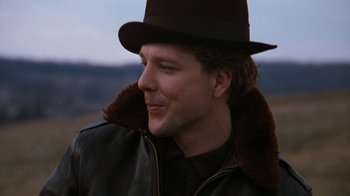 Movie still from “Diner” (1982), directed by Barry Levinson – A man wearing a hat and a leather jacket; Close Up shot, Over the shoulder angle