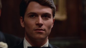 Movie still from “Diner” (1982), directed by Barry Levinson – A person wearing a tuxedo; Close Up shot, Over the shoulder angle