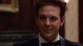 Movie still from “Diner” (1982), directed by Barry Levinson – A person wearing a suit and bow tie; Close Up shot, Low angle