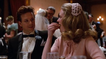 Movie still from “Diner” (1982), directed by Barry Levinson – A man and a woman sitting at a dinner table; Close Up shot, Over the shoulder angle