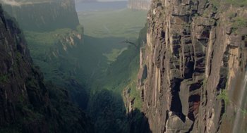 Movie still from “Dinosaur” (2000), directed by Eric Leighton – A view of a valley from the top of a cliff; Extreme Wide shot, High angle