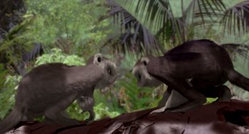 Movie still from “Dinosaur” (2000), directed by Eric Leighton – A pair of animals are fighting in the jungle; Wide shot, Low angle