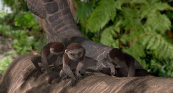 Movie still from “Dinosaur” (2000), directed by Eric Leighton – A group of monkeys sitting on top of a tree branch; Wide shot, High angle