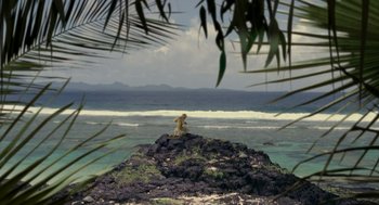 Movie still from “Dinosaur” (2000), directed by Eric Leighton – A fire hydrant on top of a rock near the ocean; Extreme Wide shot, High angle