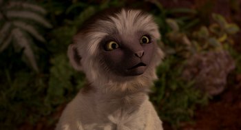 Movie still from “Dinosaur” (2000), directed by Eric Leighton – The face of an animal with brown eyes; Close Up shot, High angle