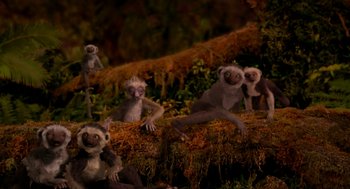 Movie still from “Dinosaur” (2000), directed by Eric Leighton – A group of monkeys sitting and standing on top of a log; Wide shot, High angle
