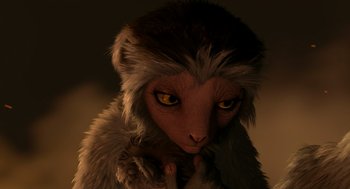 Movie still from “Dinosaur” (2000), directed by Eric Leighton – An animated monkey with yellow eyes is holding something; Extreme Close Up shot, High angle