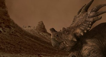 Movie still from “Dinosaur” (2000), directed by Eric Leighton – An image of an animal that is in the desert; Extreme Wide shot, Low angle