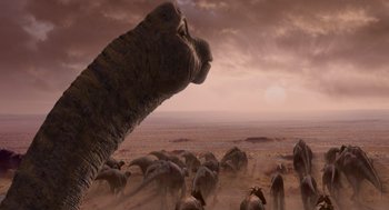 Movie still from “Dinosaur” (2000), directed by Eric Leighton – An elephant standing in the middle of a herd of animals; Extreme Wide shot, Low angle