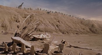 Movie still from “Dinosaur” (2000), directed by Eric Leighton – A skeleton of an animal in the desert; Extreme Wide shot, Low angle