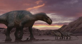 Movie still from “Dinosaur” (2000), directed by Eric Leighton – A group of dinosaurs in a field at sunset; Extreme Wide shot, Low angle