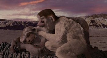 Movie still from “Dinosaur” (2000), directed by Eric Leighton – Two monkeys are sitting on the ground in front of a sky background; Wide shot, High angle
