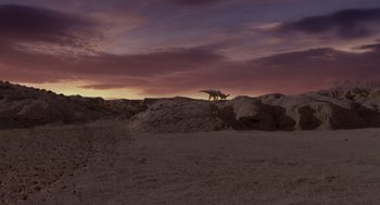 Movie still from “Dinosaur” (2000), directed by Eric Leighton – Two dogs standing on top of a hill at sunset; Extreme Wide shot, High angle