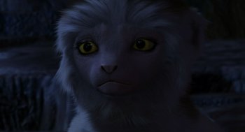 Movie still from “Dinosaur” (2000), directed by Eric Leighton – A cat's face in the dark; Close Up shot, High angle