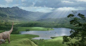 Movie still from “Dinosaur” (2000), directed by Eric Leighton – A view of a lake and a mountain range with sun rays coming through the clouds on a cloudy day; Extreme Wide shot, High angle
