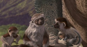 Movie still from “Dinosaur” (2000), directed by Eric Leighton – A pair of monkeys sitting next to each other on the ground; Medium shot, High angle