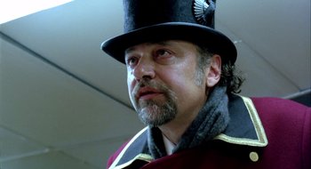 Movie still from “Dirty Pretty Things” (2002), directed by Stephen Frears – A person wearing a hat; Close Up shot, Low angle