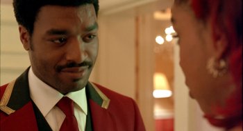 Movie still from “Dirty Pretty Things” (2002), directed by Stephen Frears – A man in a red jacket and a man in a white shirt; Close Up shot, Over the shoulder angle