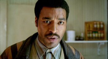 Movie still from “Dirty Pretty Things” (2002), directed by Stephen Frears – A person with a mustache; Close Up shot, Low angle