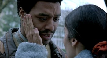 Movie still from “Dirty Pretty Things” (2002), directed by Stephen Frears – A man and a woman talking to each other; Close Up shot, Over the shoulder angle