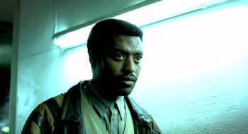 Movie still from “Dirty Pretty Things” (2002), directed by Stephen Frears – A person wearing a jacket; Close Up shot, Low angle