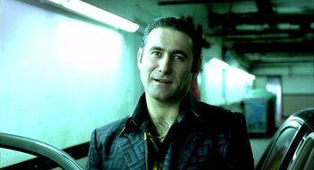 Movie still from “Dirty Pretty Things” (2002), directed by Stephen Frears – A person wearing a jacket; Close Up shot, Low angle